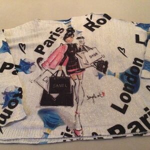 Beautiful sweater with travel logos and metallic threads.  EUC. Worn once.